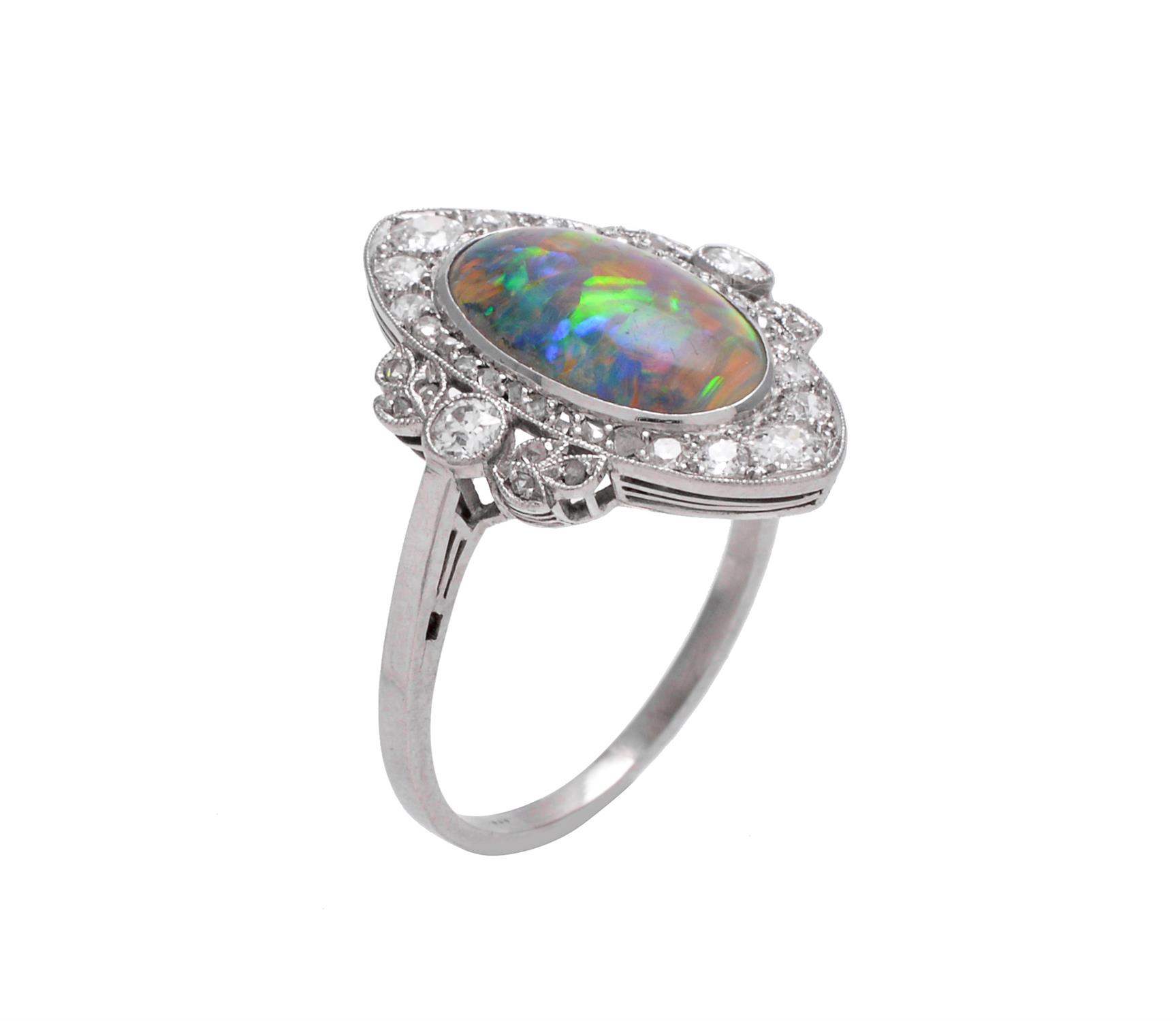 A Edwardian black opal and diamond panel ring