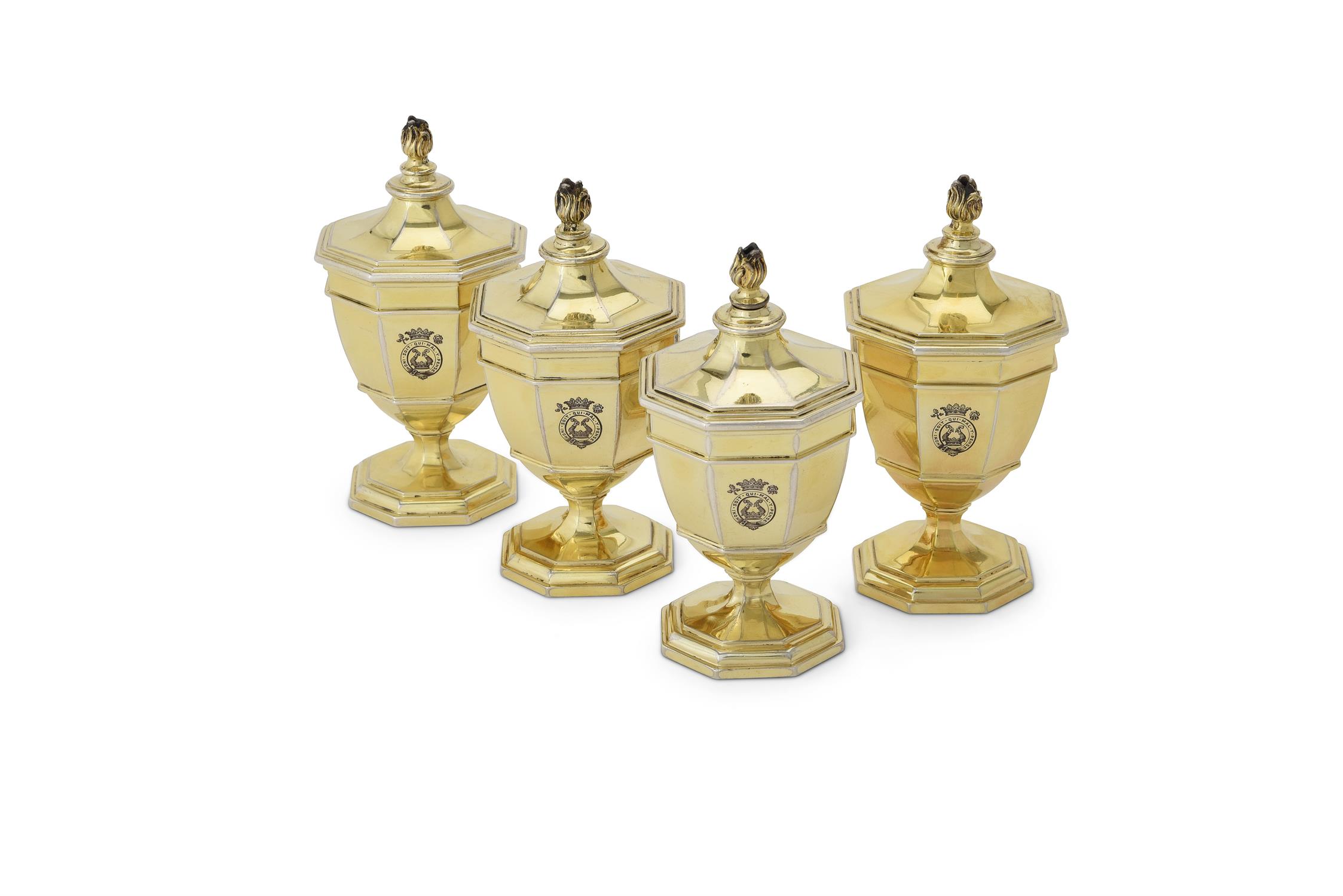 A set of four silver gilt octagonal vase shape salt cellars by Carrington & Co.