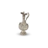 An over-sized late Victorian silver Armada pattern claret jug by Sibray