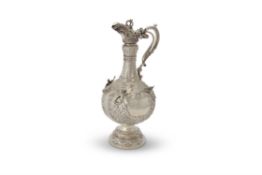 An over-sized late Victorian silver Armada pattern claret jug by Sibray