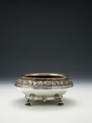 An Edwardian Arts and Crafts hammered silver rose bowl by Omar Ramsden & Alwyn Carr