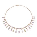 An Edwardian pink tourmaline, aquamarine and peridot gold necklace