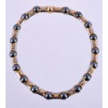 A steel, hematite and gold coloured collar necklace by Bulgari