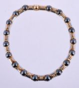 A steel, hematite and gold coloured collar necklace by Bulgari