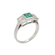 A five stone emerald and diamond ring