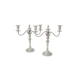 A pair of silver circular three light candelabra by Barker Ellis Silver Co.
