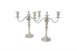 A pair of silver circular three light candelabra by Barker Ellis Silver Co.