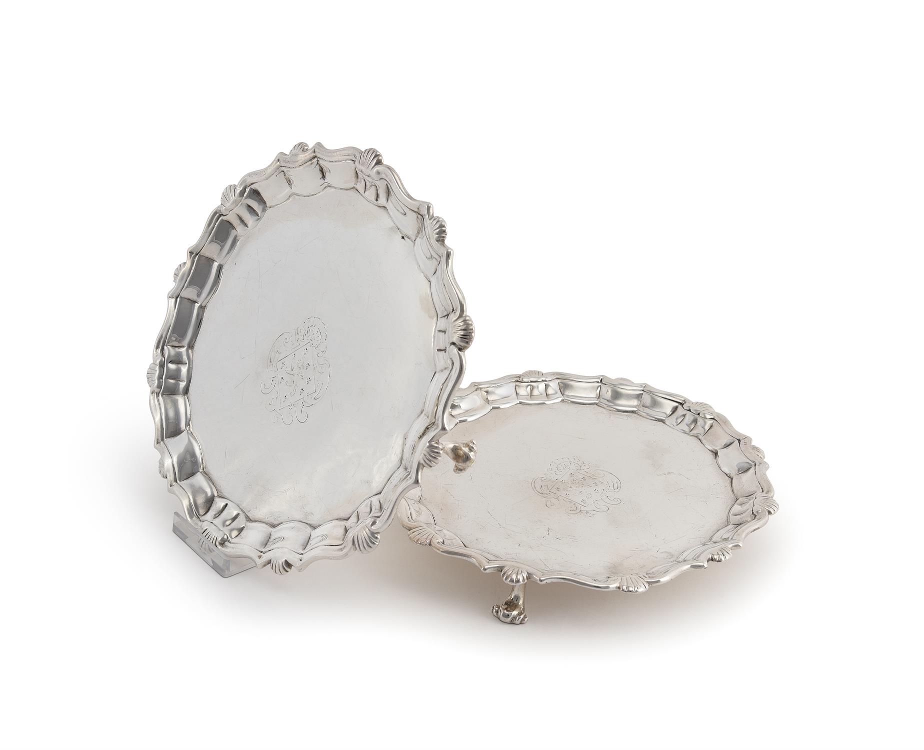 A pair of George II silver shaped circular waiters by Joseph Sanders