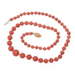 Y A graduated coral bead necklace