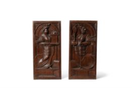 A pair of Flemish sculpted oak allegorical panels