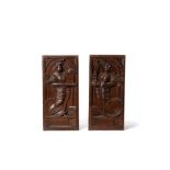 A pair of Flemish sculpted oak allegorical panels