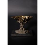 A patinated bronze table salt in the form of a clam shell
