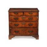 A George II walnut and crossbanded chest of drawers