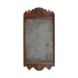 A George II walnut and parcel gilt wall mirror