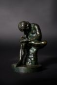 An Italian green patinated bronze model of the Spinario