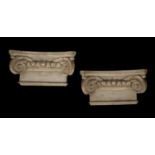 A pair of painted plaster Ionic order capitals