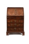 A George II walnut feather banded bureau