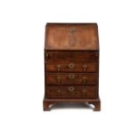 A George II walnut feather banded bureau