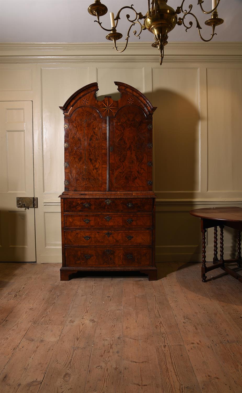 A George I walnut and featherbanded secretaire cabinet