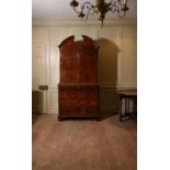A George I walnut and featherbanded secretaire cabinet