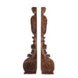 A pair of Continental carved oak caryatid pilasters