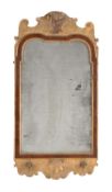 A George I gilt gesso, walnut and parcel gilt wall mirror