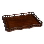 A George III mahogany serpentine tray