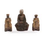 A pair of Chinese carved wood figures of dignitaries and another of a seated Lohan