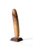 Y A carved ivory model of a phallus