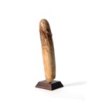 Y A carved ivory model of a phallus