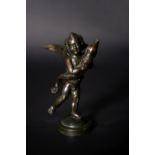 An Italian patinated bronze model of a putto with a dolphin after Andrea del Verrocchio (1435-1488)