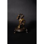 An Italian patinated bronze figural inkwell with Atlas supporting the globe