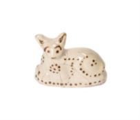 A Staffordshire creamware model of a recumbent cat