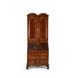 A Queen Anne walnut and feather banded bureau bookcase