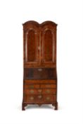 A Queen Anne walnut and feather banded bureau bookcase