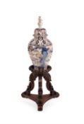 An Anglo-Indian carved exotic hardwood vase stand