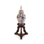 An Anglo-Indian carved exotic hardwood vase stand