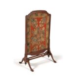 A George I mahogany and needlework inset fire screen