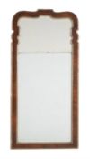 A George II walnut and parcel gilt wall mirror