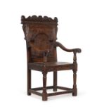 An oak wainscot armchair