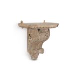 A carved pine architectural wall bracket