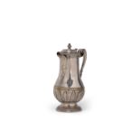 A silvered brass baluster jug