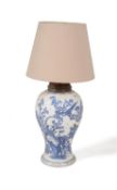 A large Chinese blue and white baluster vase adapted as a lamp