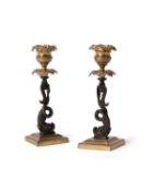 A pair of Regency gilt and patinated bronze candlesticks