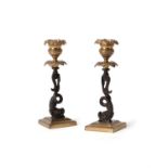 A pair of Regency gilt and patinated bronze candlesticks