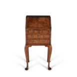 A George I walnut and crossbanded bureau