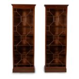 A pair of mahogany bookcases, by HOWARD & SONS