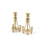 A pair of Napoleon III gilt bronze and onyx mounted candlesticks