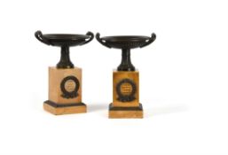 A pair of Restauration patinated bronze and Siena marble tazzas on plinths