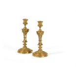 A pair of gilt bronze candlesticks